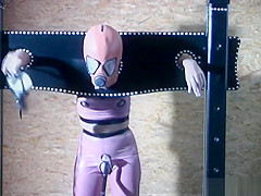 Gimp girl locked in box and pillory